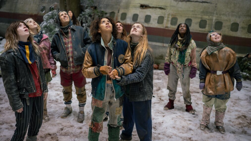 L-R: Sophie Thatcher as Teen Natalie, Jenna Burgess as Teen Melissa, Kevin Alves as Teen Travis, Courtney Eaton as Teen Lottie, Jasmin Savoy Brown as Teen Taissa, Sophie Nélisse as Teen Shauna, Liv Hewson as Teen Van, Nia Sondaya as Teen Akilah and Samantha Hanratty as Teen Misty in 'Yellowjackets' Season 4 Episode 8