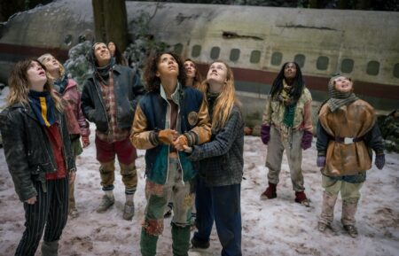 L-R: Sophie Thatcher as Teen Natalie, Jenna Burgess as Teen Melissa, Kevin Alves as Teen Travis, Courtney Eaton as Teen Lottie, Jasmin Savoy Brown as Teen Taissa, Sophie Nélisse as Teen Shauna, Liv Hewson as Teen Van, Nia Sondaya as Teen Akilah and Samantha Hanratty as Teen Misty in 'Yellowjackets' Season 4 Episode 8