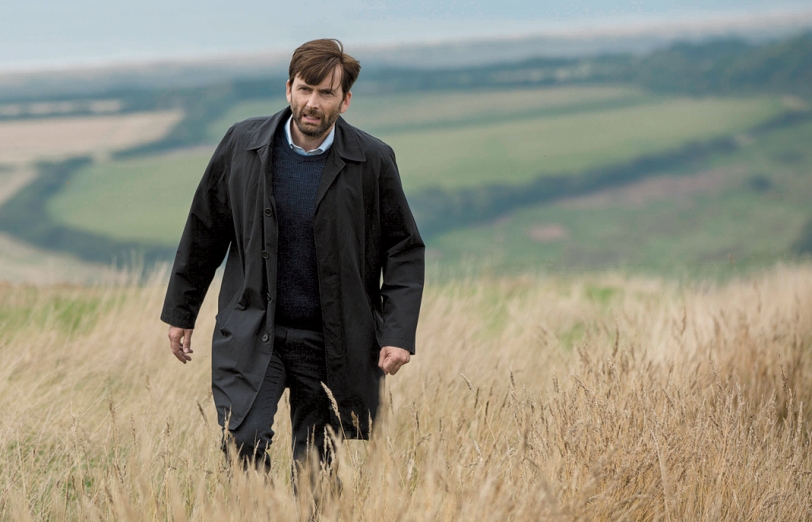 David Tennant walking through a field in Broadchurch